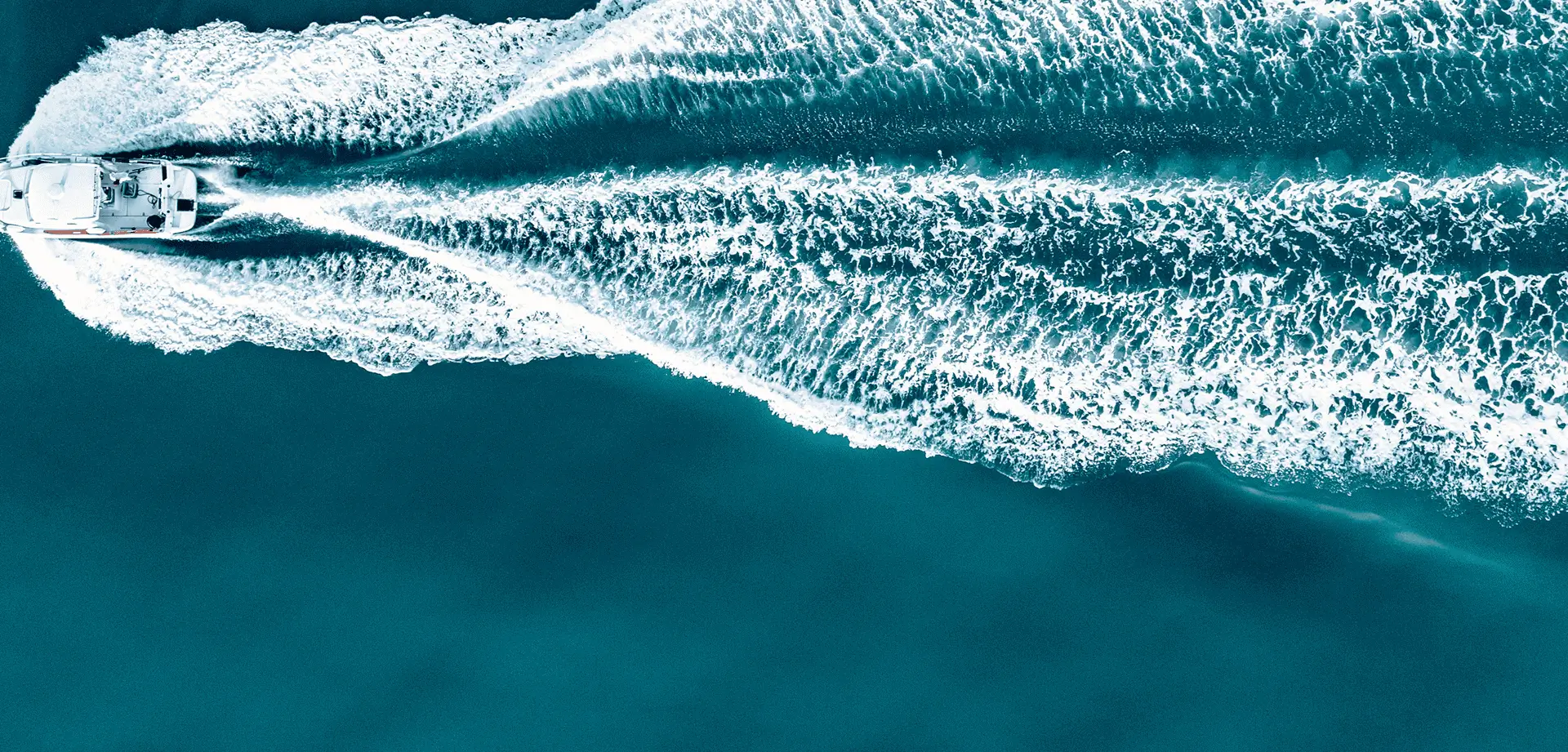 Boat creating waves in ocean