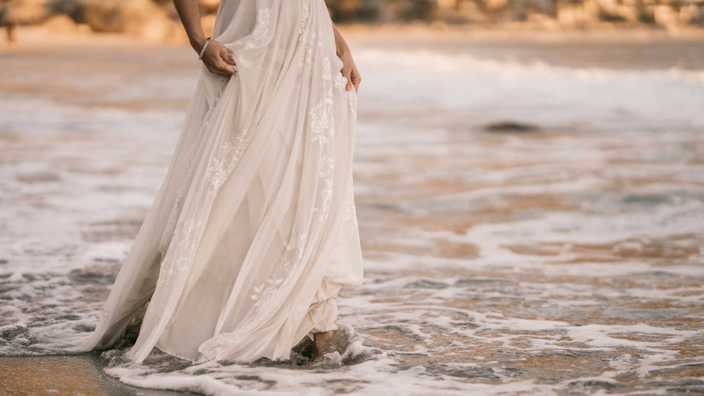 a person standing on a sandy beach